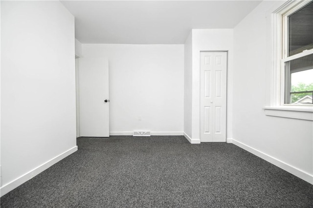 1036 7th St, West Elizabeth, PA 15088 - empty room with dark carpet and baseboards