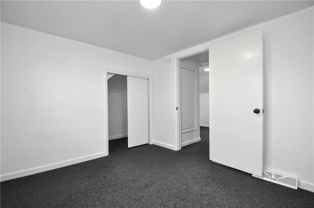 1036 7th St, West Elizabeth, PA 15088 - unfurnished bedroom with dark colored carpet, a closet, and baseboards