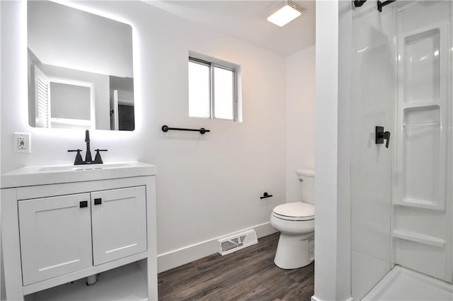 1036 7th St, West Elizabeth, PA 15088 - full bathroom featuring a stall shower, wood finished floors, toilet, vanity, and baseboards