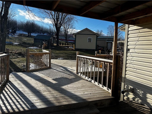 wooden deck featuring a storage shed