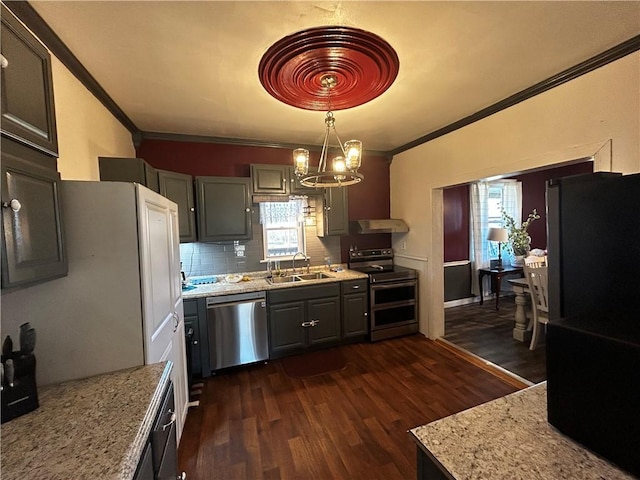 kitchen with dark hardwood / wood-style flooring, sink, crown molding, and appliances with stainless steel finishes