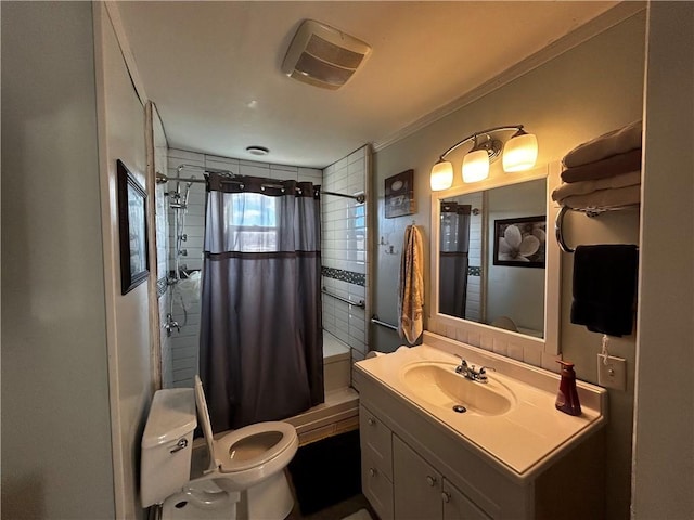 bathroom with vanity, ornamental molding, toilet, and walk in shower