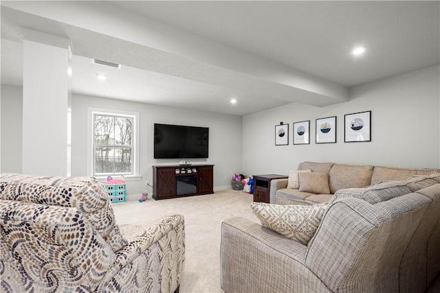 carpeted living area with recessed lighting, visible vents, and baseboards