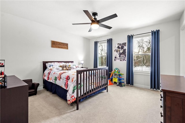 bedroom featuring carpet floors, ceiling fan, and baseboards