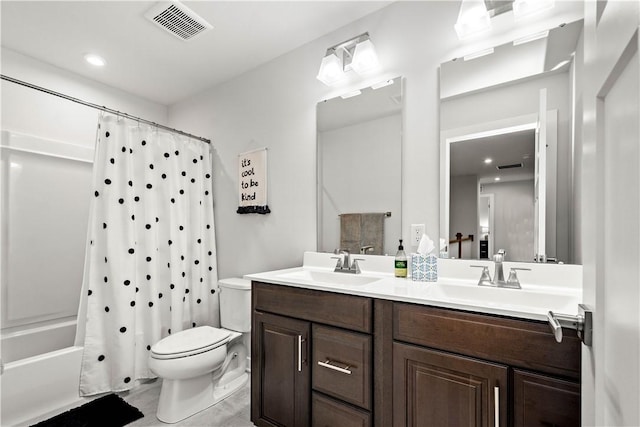 full bathroom featuring shower / bath combination with curtain, visible vents, a sink, and toilet