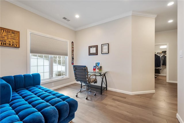 office space with ornamental molding and hardwood / wood-style floors