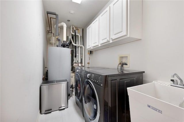 laundry room featuring cabinets, separate washer and dryer, sink, and water heater