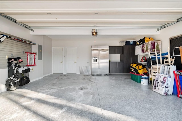 garage with built in refrigerator, a garage door opener, and electric panel