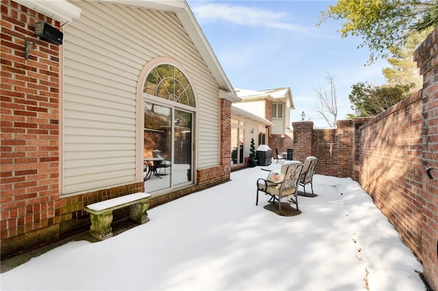 view of snow covered patio