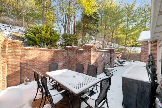 view of snow covered patio