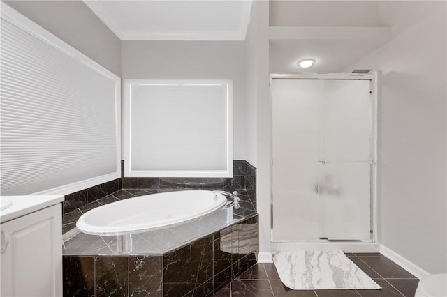 bathroom featuring ornamental molding, independent shower and bath, and vanity