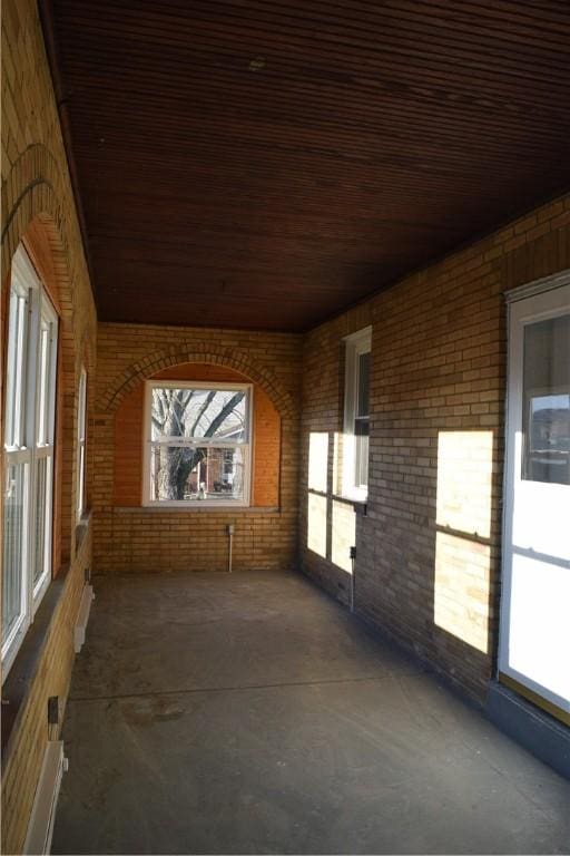 unfurnished sunroom featuring a healthy amount of sunlight