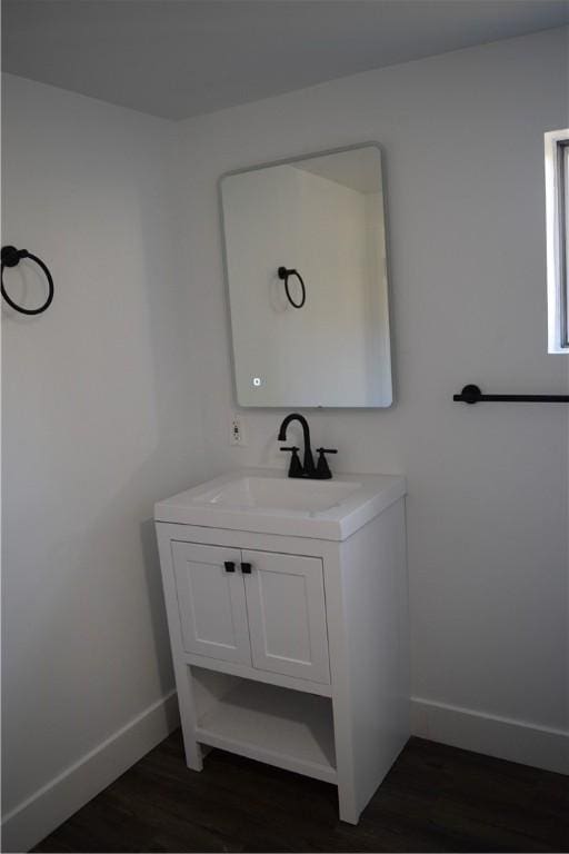 bathroom with vanity and wood-type flooring