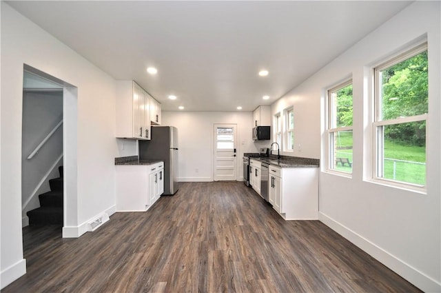 1036 7th St, West Elizabeth, PA 15088 - kitchen with stainless steel appliances, dark wood-style flooring, baseboards, white cabinetry, and recessed lighting