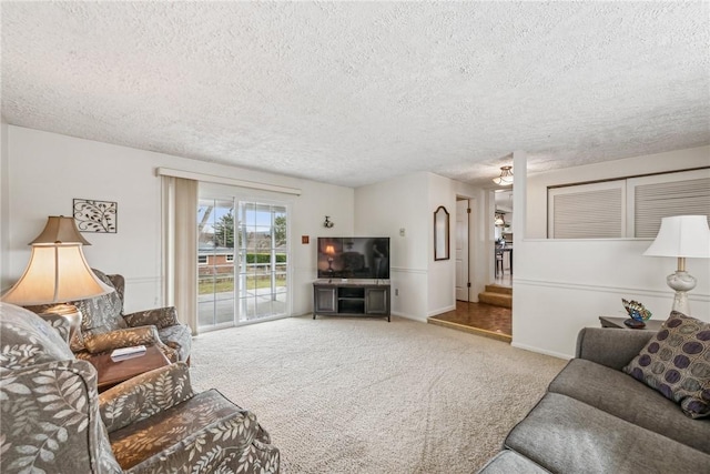 living room with carpet and a textured ceiling