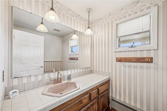 bathroom featuring a baseboard radiator and vanity