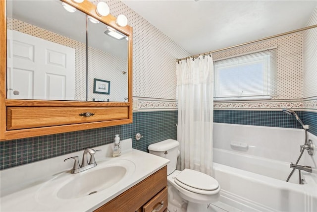 full bathroom featuring tile walls, vanity, shower / bath combo, and toilet