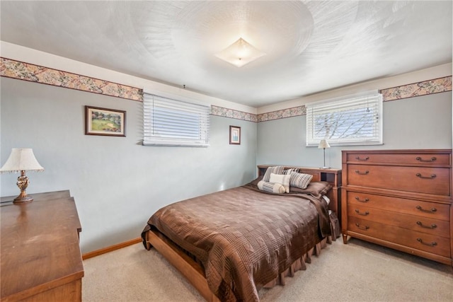 bedroom with light colored carpet