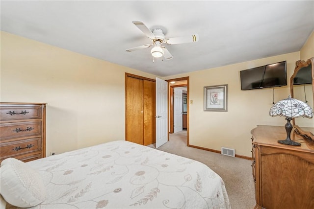 bedroom with light colored carpet and ceiling fan