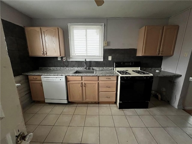 kitchen with light tile patterned flooring, dishwasher, sink, light brown cabinets, and black range with gas cooktop