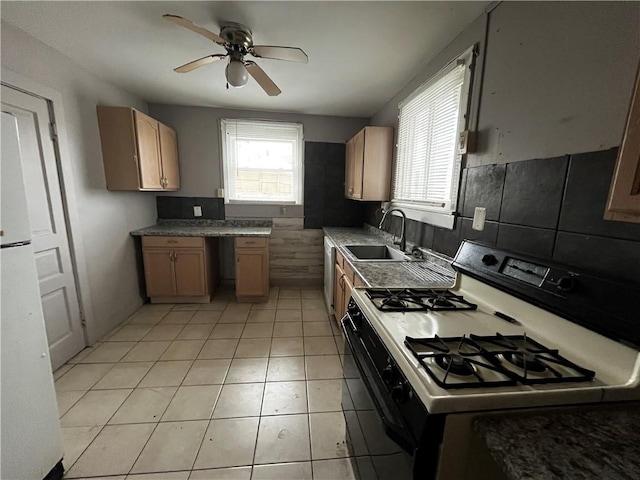 kitchen featuring sink, white appliances, built in desk, light tile patterned floors, and ceiling fan