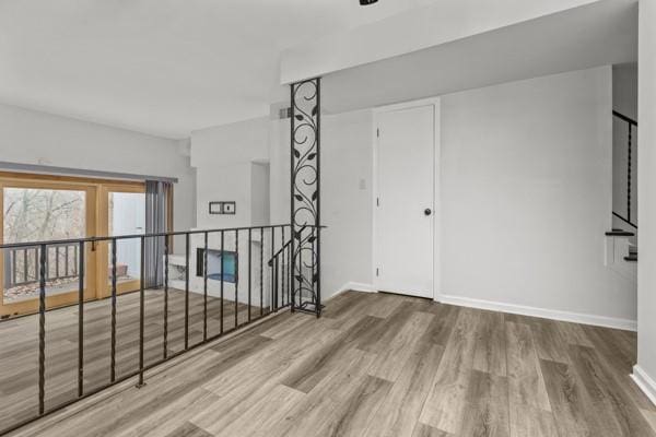 unfurnished room featuring hardwood / wood-style floors