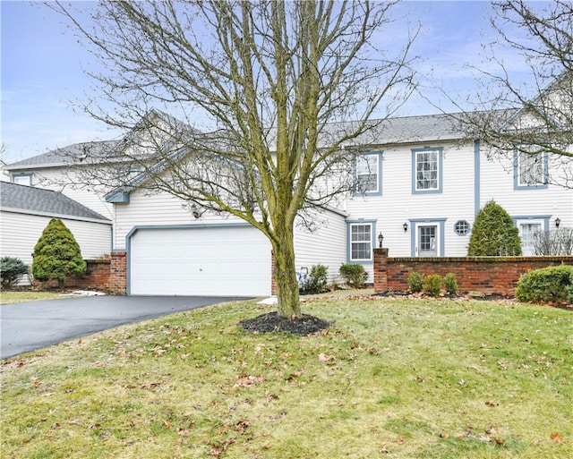 view of front facade featuring a garage and a front lawn