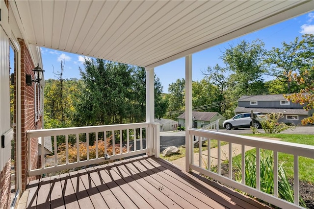 wooden terrace featuring covered porch