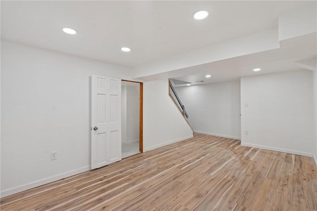 basement featuring light hardwood / wood-style flooring