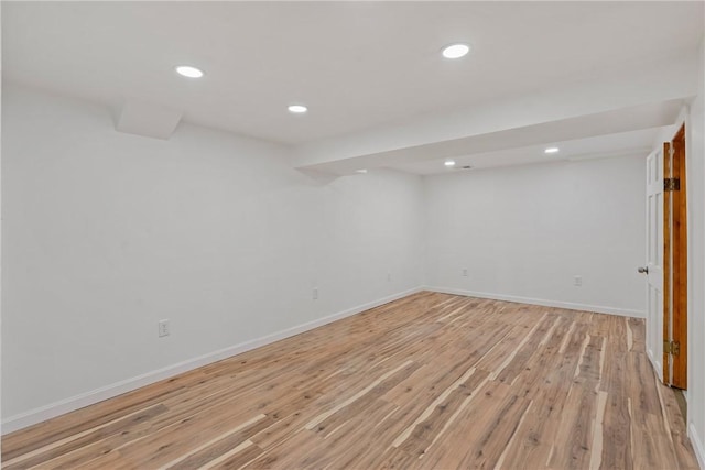 basement featuring light hardwood / wood-style flooring