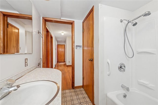 bathroom featuring vanity and shower / bathing tub combination