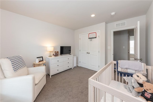 carpeted bedroom with a closet