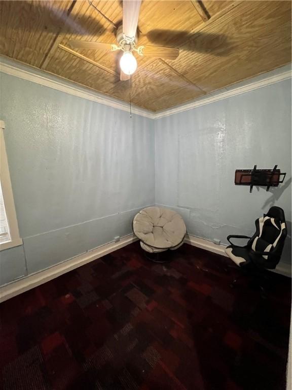 interior space featuring hardwood / wood-style flooring, crown molding, wooden ceiling, and ceiling fan