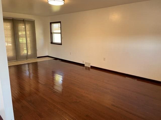 unfurnished room featuring wood-type flooring