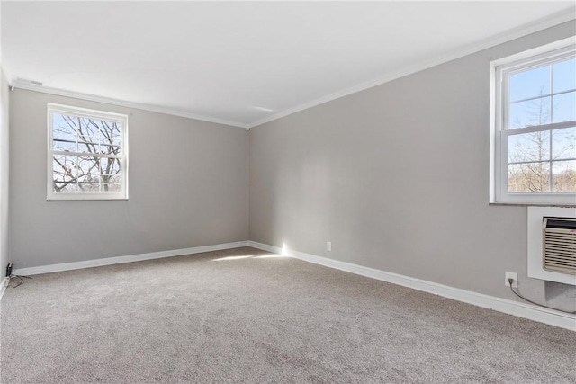 unfurnished room with a wall mounted air conditioner, ornamental molding, and carpet