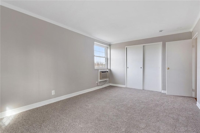 unfurnished bedroom featuring a wall mounted air conditioner, ornamental molding, a closet, and carpet flooring