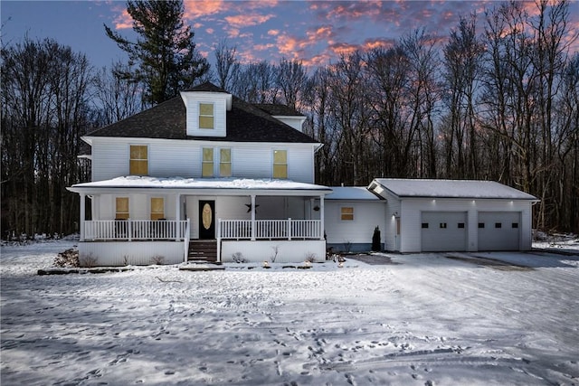 view of front facade with a porch and a garage