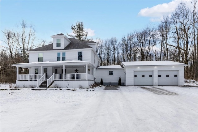 view of front of property with a garage and covered porch