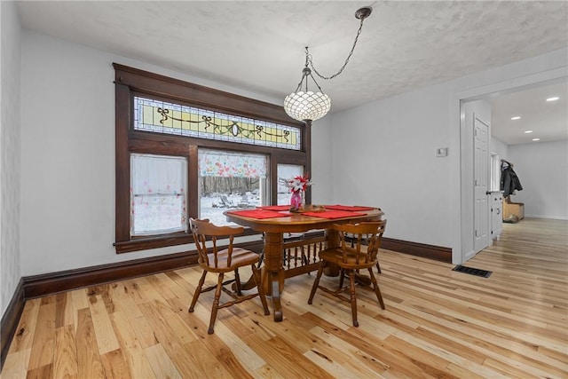 dining room with light hardwood / wood-style flooring