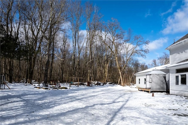 view of yard layered in snow