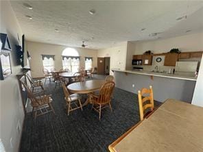 dining space with carpet flooring