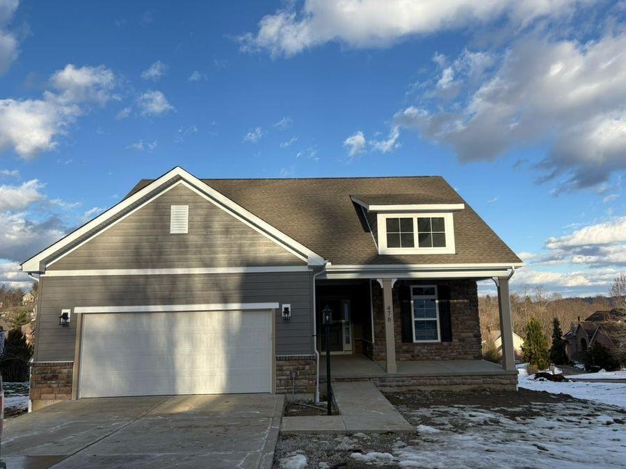 view of front of property with a garage and covered porch