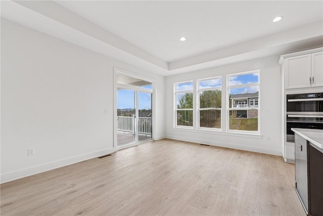 interior space with light wood-type flooring, visible vents, baseboards, and recessed lighting