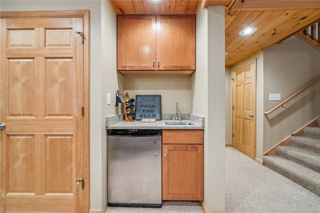 kitchen with recessed lighting, wood ceiling, a sink, and fridge