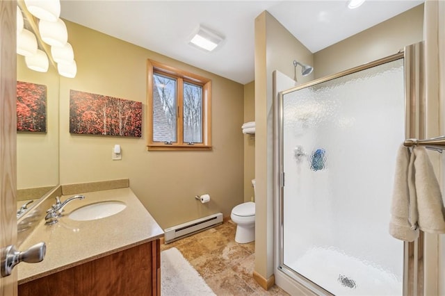 bathroom with baseboards, toilet, baseboard heating, vanity, and a shower stall