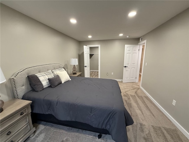 bedroom featuring light carpet