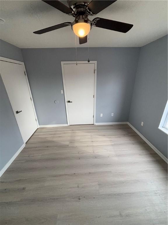 spare room with light hardwood / wood-style floors