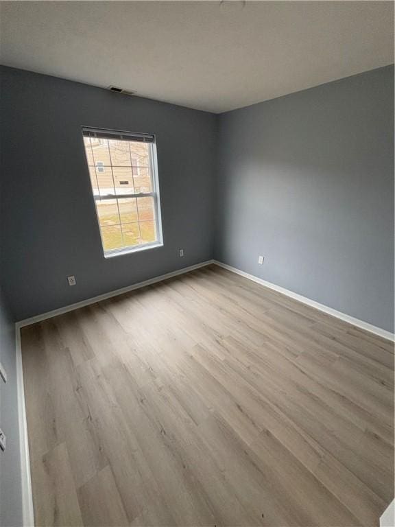 empty room with light wood-type flooring