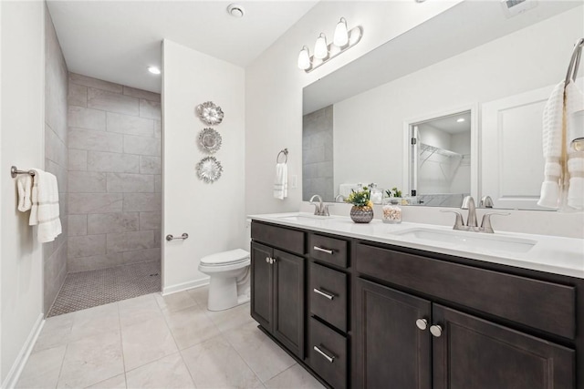 full bathroom featuring a walk in shower, double vanity, a sink, and toilet