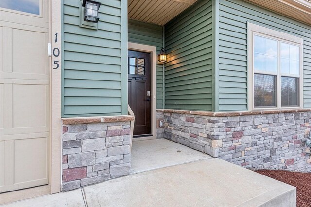 entrance to property with stone siding